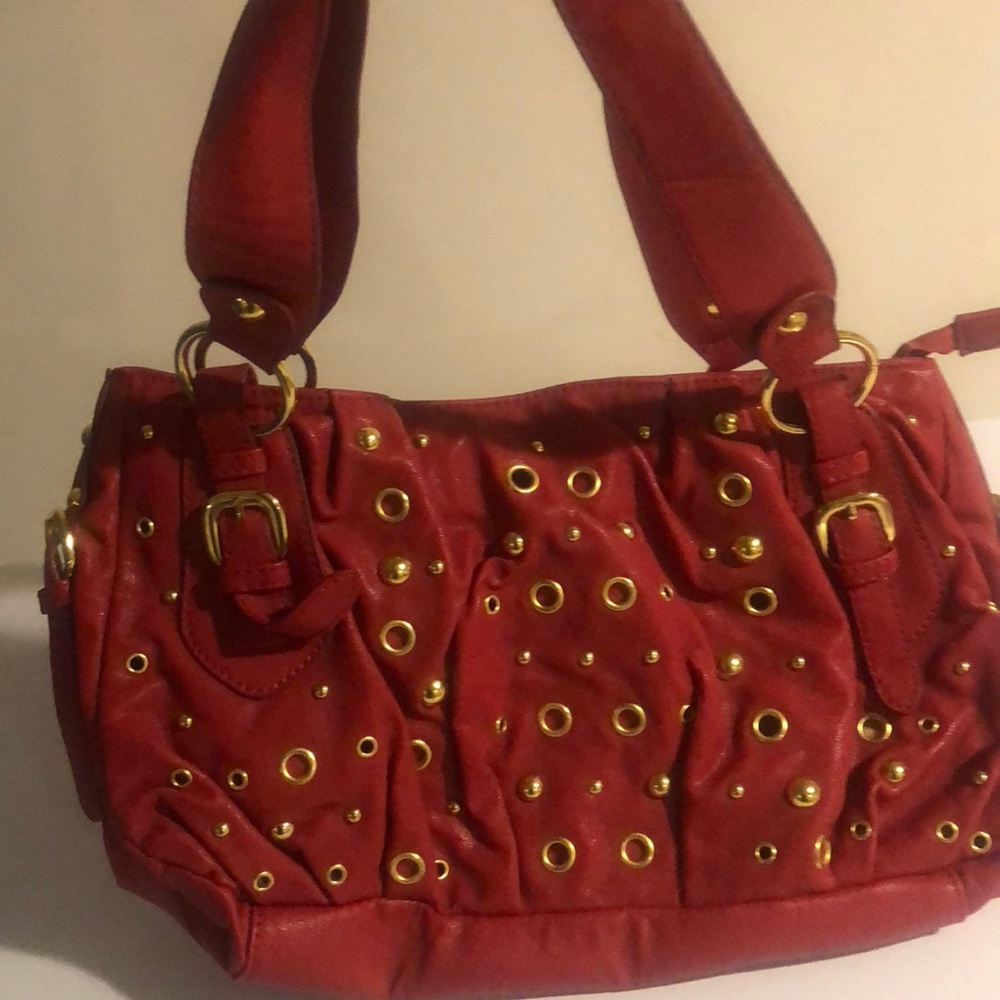 Red and gold grommet shoulder bag
